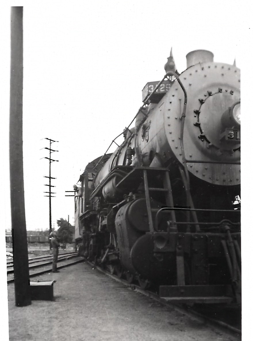 This image has an empty alt attribute; its file name is 1949-Elsie-Eng-3129-Engr-Brkmn-discuss-work-761x1024.jpg